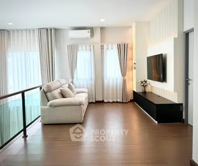 Spacious modern living room with sleek design and natural light
