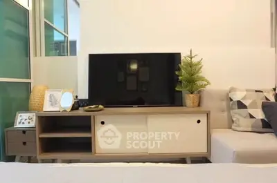 Modern living room with sleek TV stand and cozy decor