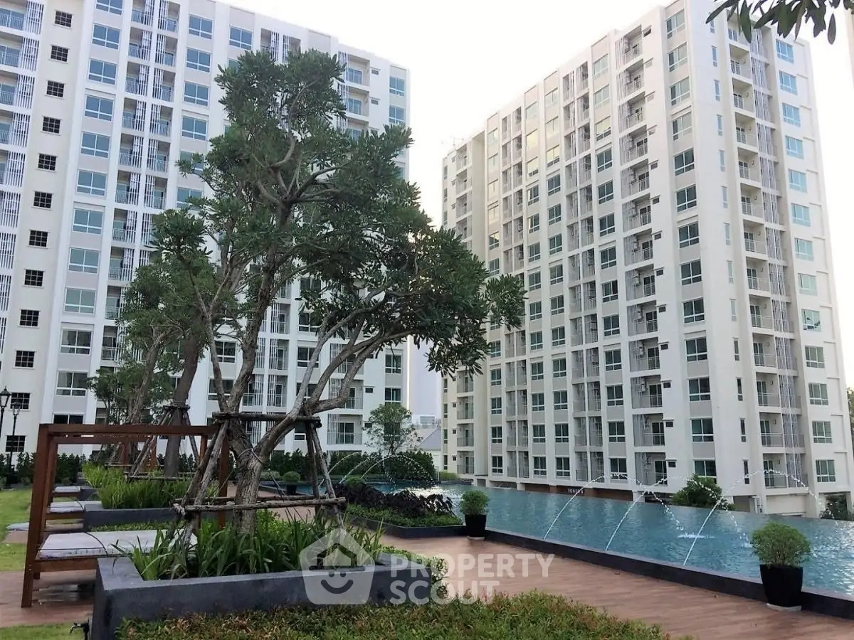 Modern condominium with pool and landscaped garden in urban setting