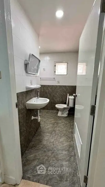 Modern bathroom with sleek design and tiled flooring