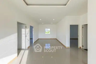 Spacious modern living room with minimalist design and natural light