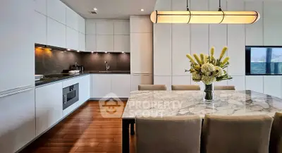 Luxurious modern kitchen with marble dining table and elegant lighting