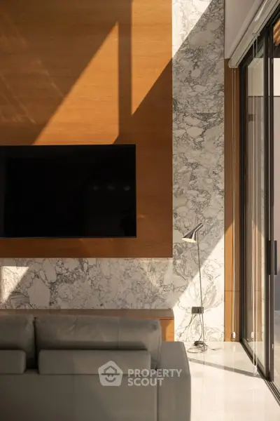 Luxurious modern living room with marble accents and sleek TV setup