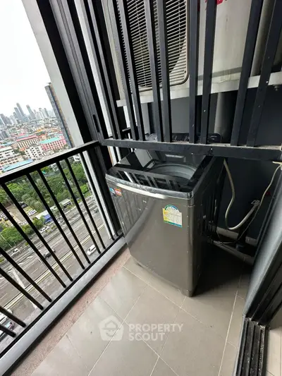 High-rise balcony with washing machine and city view, perfect for urban living.