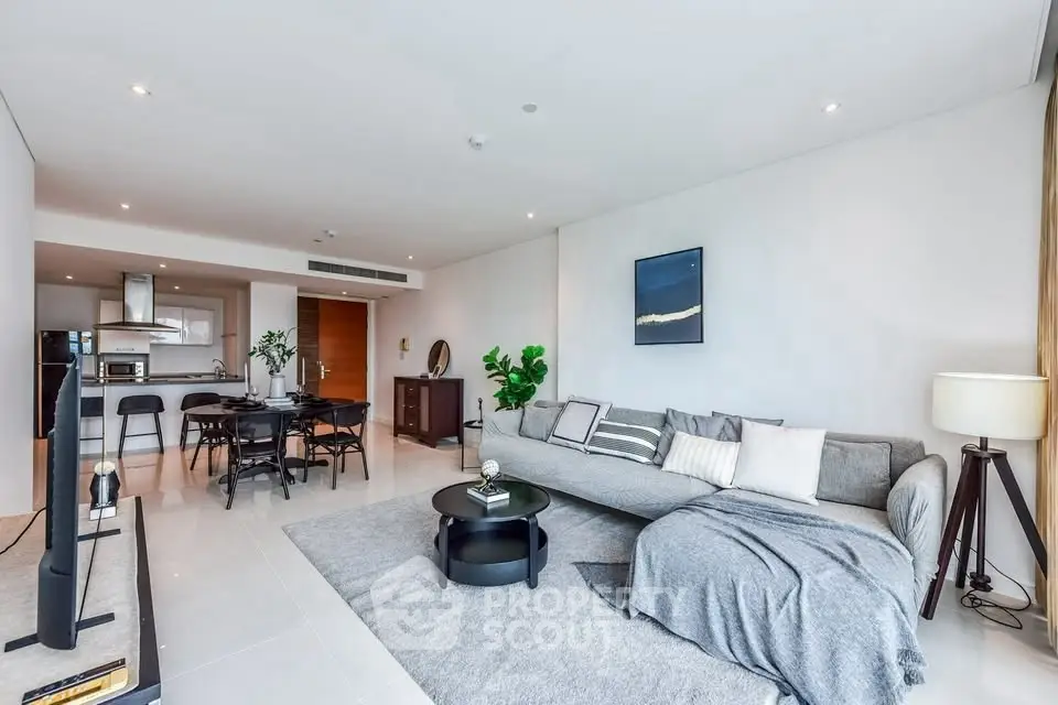 Spacious modern living room with open kitchen and stylish decor