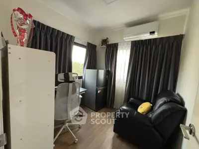 Cozy study room with modern furniture and air conditioning, perfect for productivity and comfort.