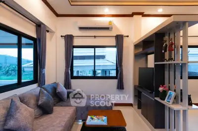 Modern living room with cozy sectional sofa and stylish entertainment center