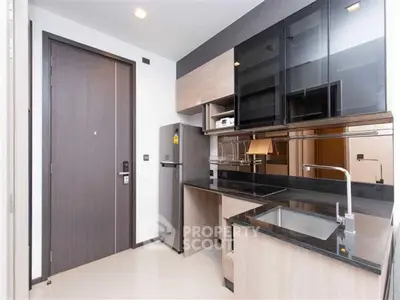 Modern kitchen with sleek cabinetry and stainless steel appliances
