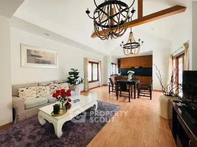 Spacious living room with elegant decor and open kitchen layout