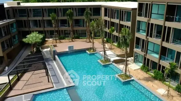 Luxurious modern apartment complex with stunning pool and lush landscaping.