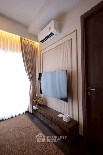 Modern living room with sleek TV setup and elegant decor
