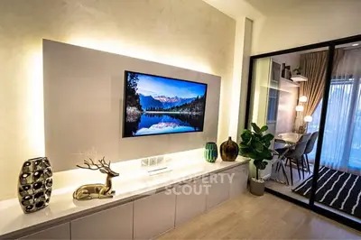 Modern living room with stylish decor and open view to dining area
