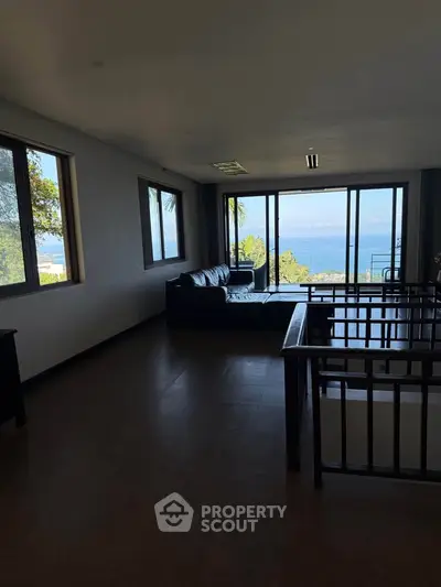 Spacious living room with stunning ocean view and modern furnishings