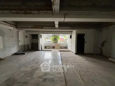 Spacious unfinished interior space with potential for customization and renovation.