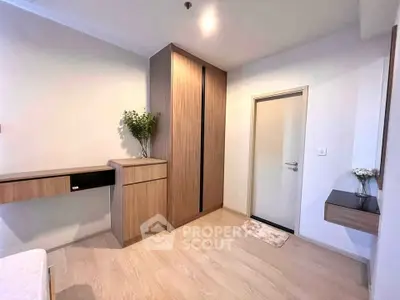 Modern bedroom with sleek wooden furniture and minimalist decor