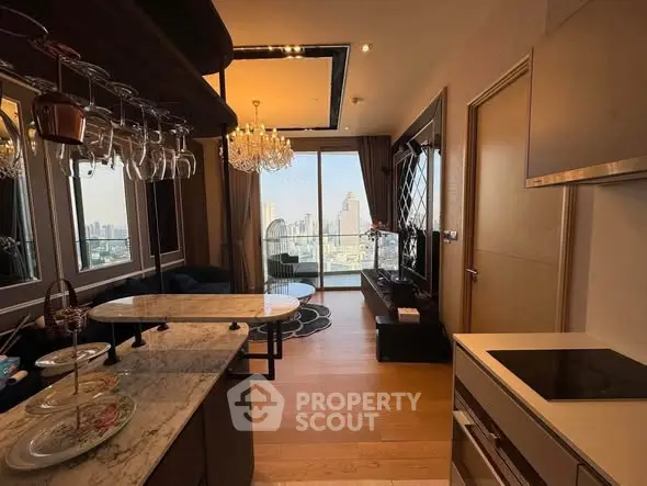 Luxurious modern living room with city view, elegant chandelier, and open kitchen layout.