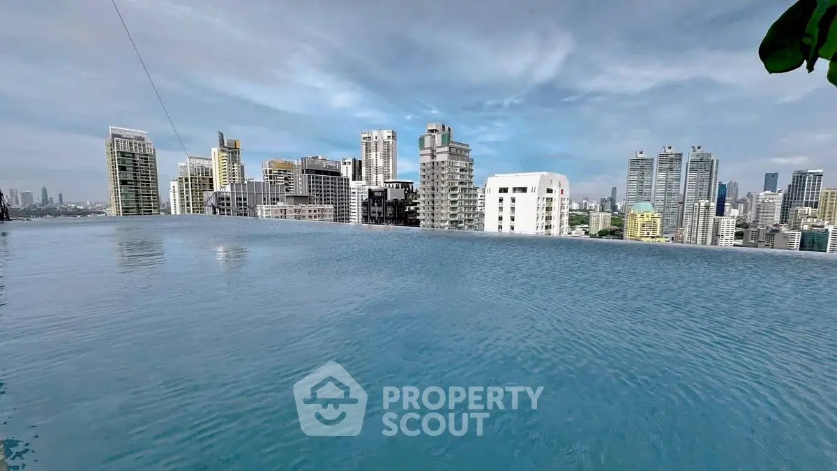 Stunning rooftop infinity pool with panoramic city skyline views.