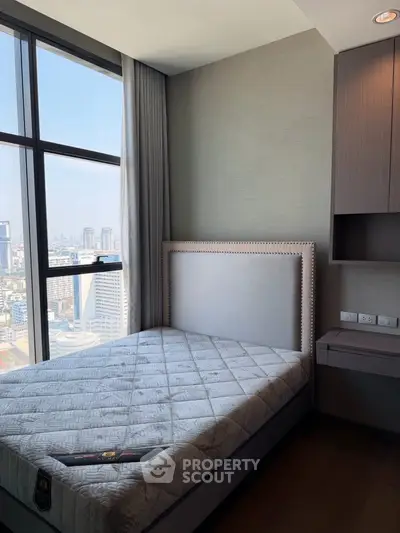 Modern bedroom with stunning city view and elegant decor