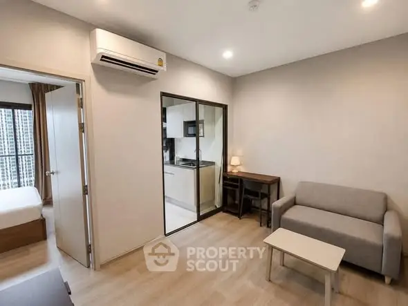 Modern apartment interior with cozy living room and compact kitchen