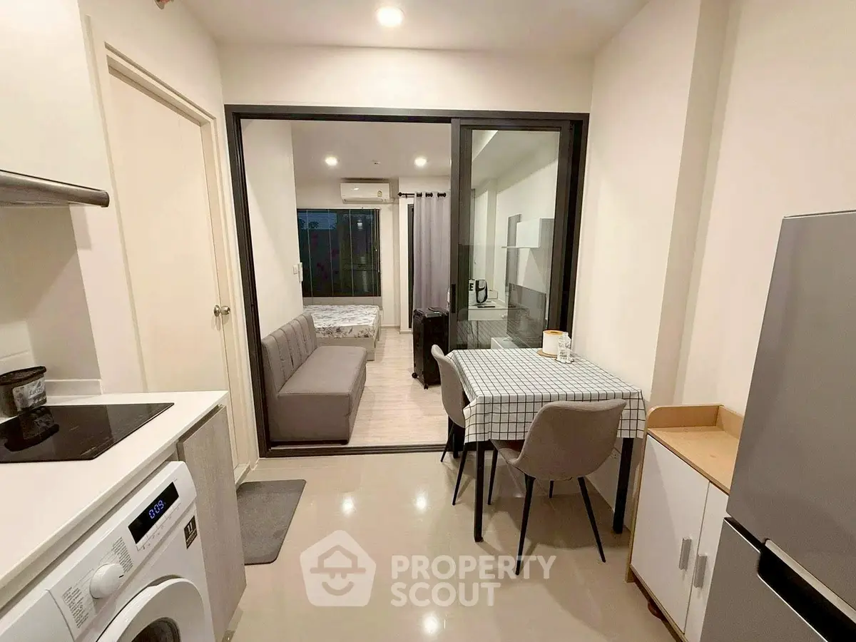 Modern compact apartment with open kitchen and cozy living area