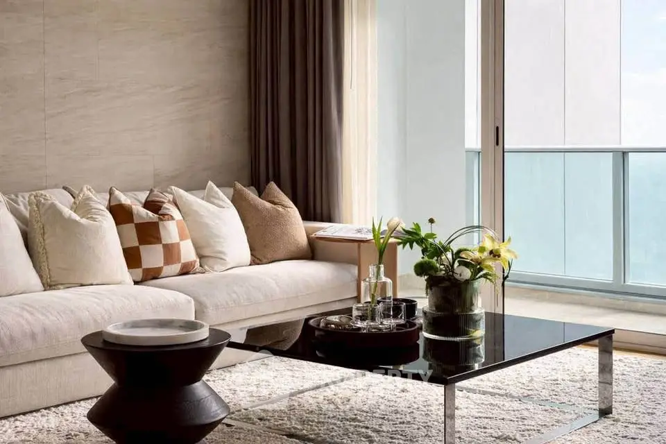 Luxurious living room with modern decor and large windows offering stunning views.