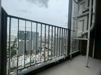 High-rise balcony with stunning city skyline view, perfect for urban living.