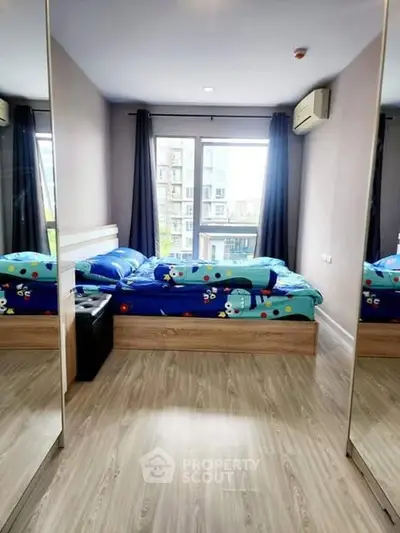 Modern bedroom with mirrored closet and large window view