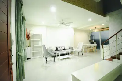 Spacious modern living room with elegant decor and dining area