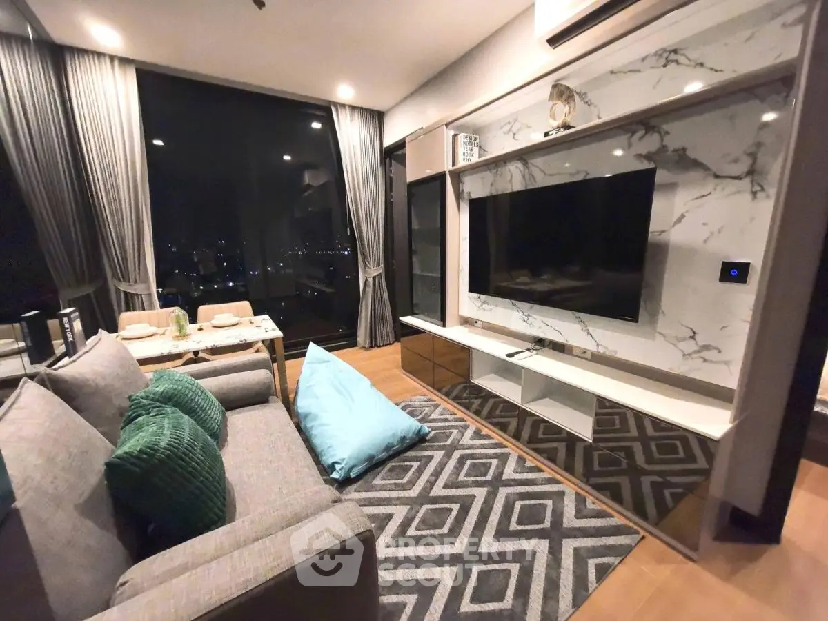 Modern living room with stylish decor and large window view