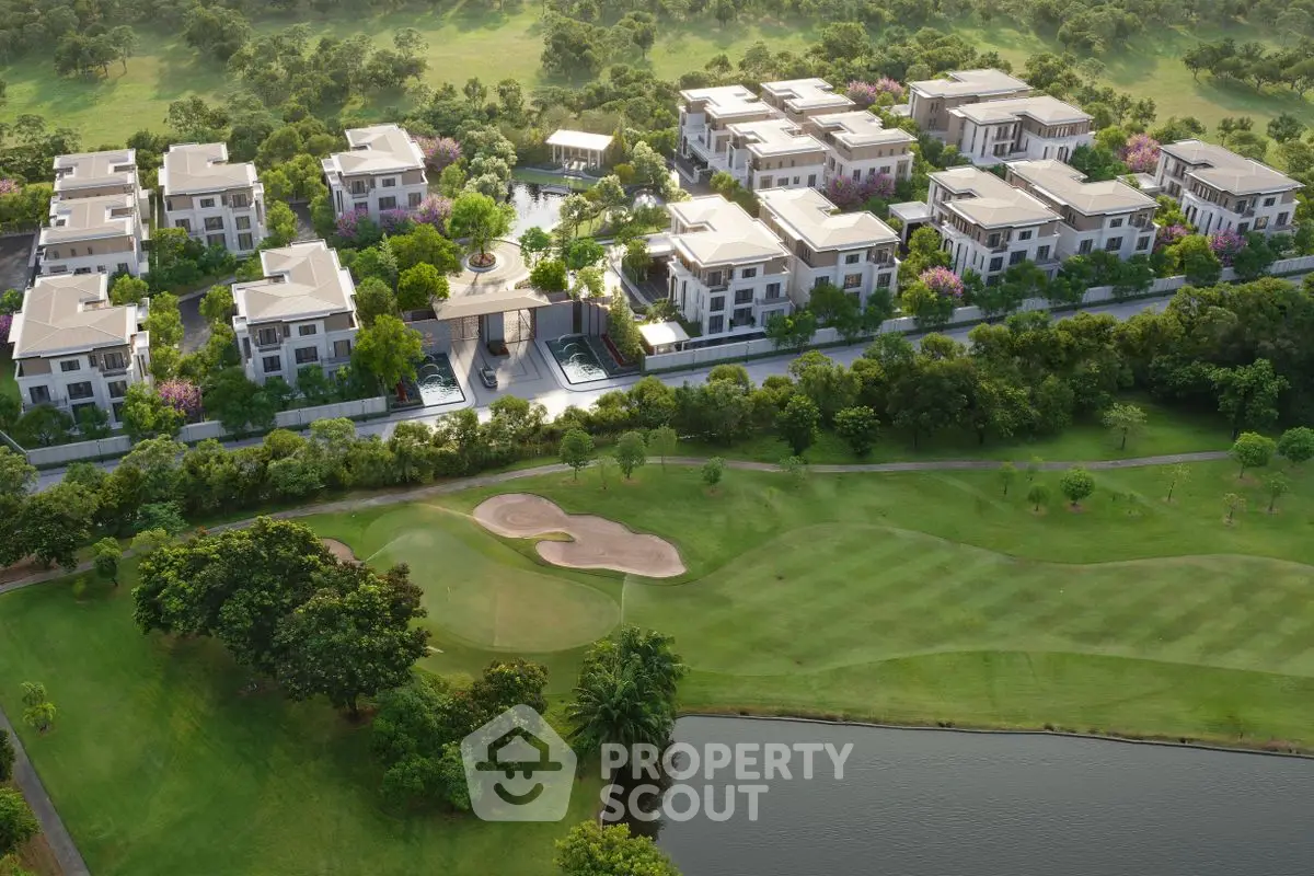 Luxurious residential complex with lush greenery and golf course view.