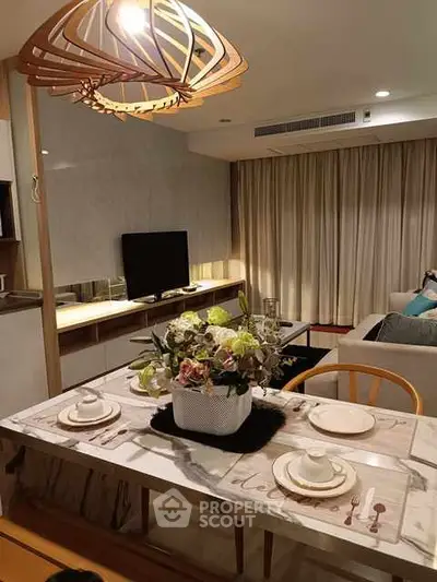 Elegant dining area with modern decor and ambient lighting in a stylish apartment.