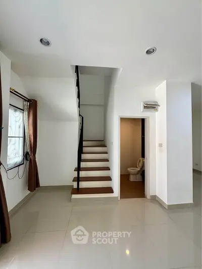 Modern minimalist interior with staircase and bathroom, bright and spacious design
