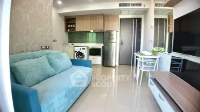 Modern living room with stylish kitchen and washing machine in compact apartment