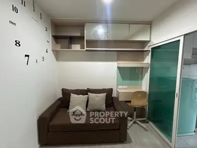 Cozy living room with modern shelving and stylish wall clock, perfect for urban living.