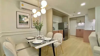 Modern dining area with elegant decor and open kitchen layout