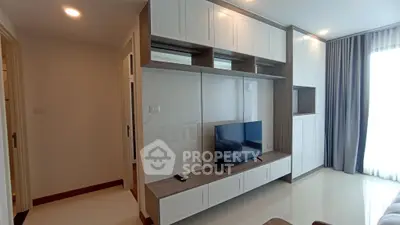 Modern living room with sleek TV unit and elegant cabinetry