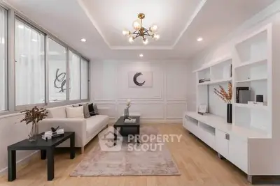 Elegant modern living room with stylish decor and ample natural light
