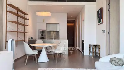 Modern open-plan living room with sleek kitchen and stylish dining area