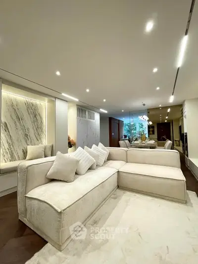 Luxurious modern living room with elegant beige sofa and ambient lighting