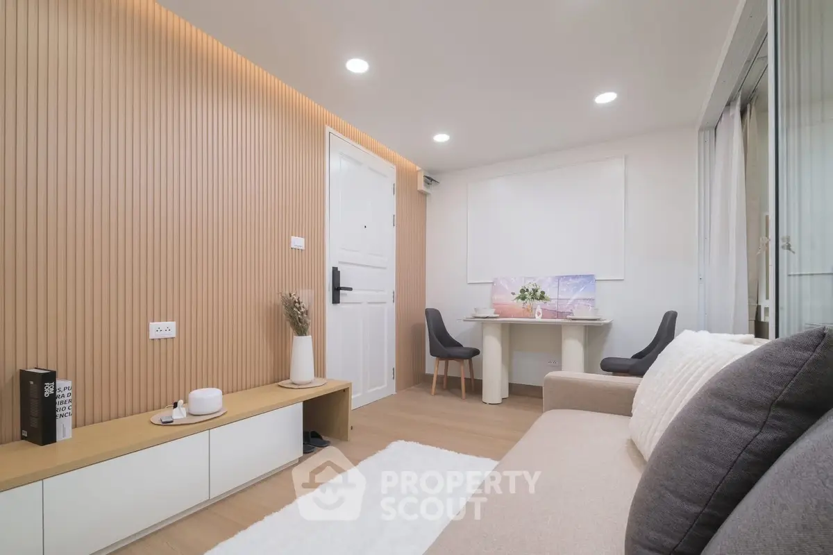 Modern living room with stylish decor and cozy seating area, perfect for relaxation and entertainment.
