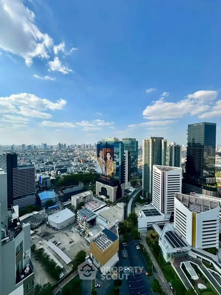 Stunning cityscape view from high-rise building showcasing urban skyline and modern architecture.
