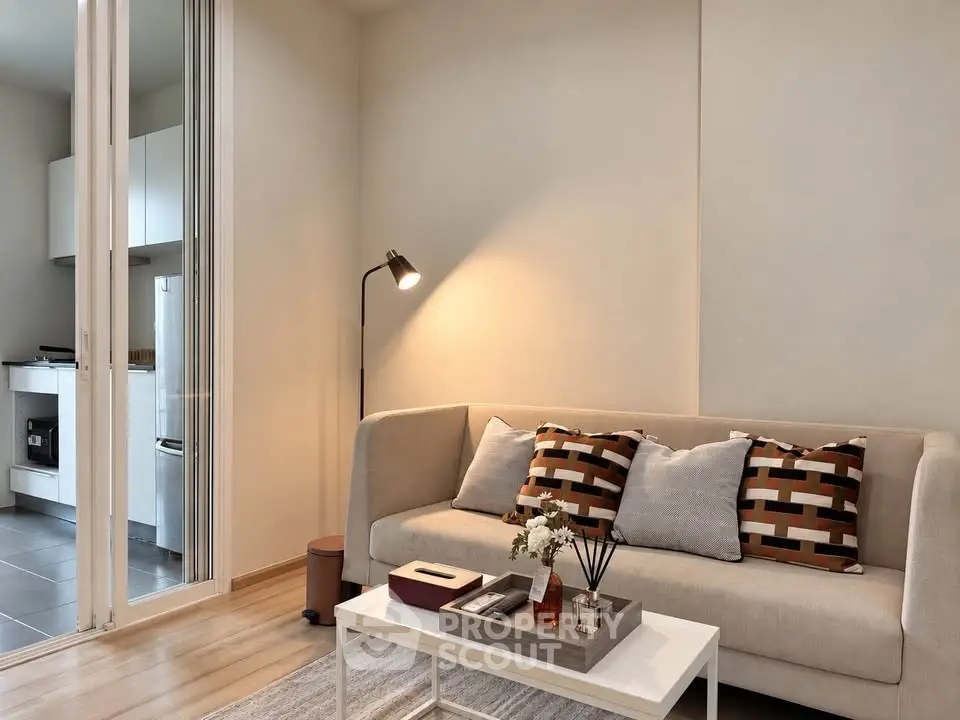 Modern living room with stylish decor and open kitchen view