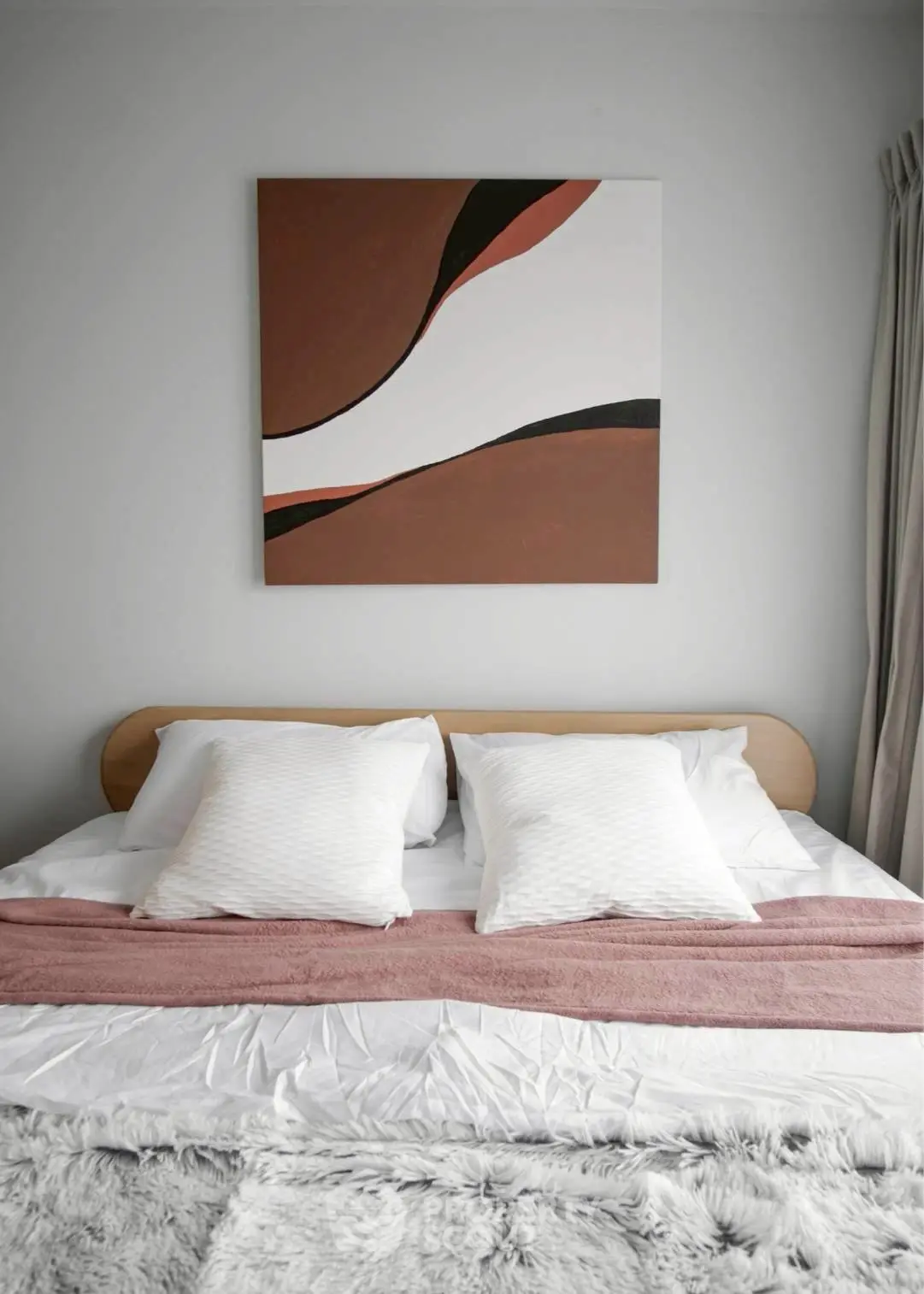 Modern bedroom with stylish decor and cozy bedding