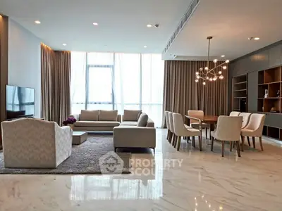 Luxurious modern living room with elegant furniture and large windows