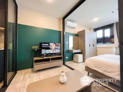 Modern bedroom with stylish decor and entertainment setup