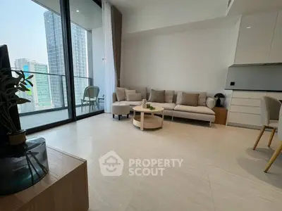 Modern living room with large windows and balcony in high-rise apartment