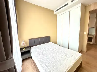 Modern bedroom with minimalist design and ample natural light
