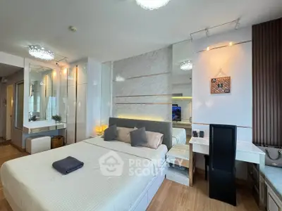 Modern bedroom with elegant decor and ample natural light