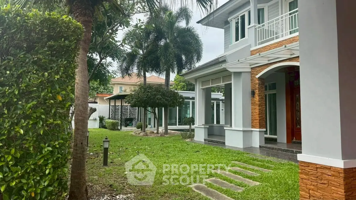 Spacious modern home with lush garden and elegant exterior design.