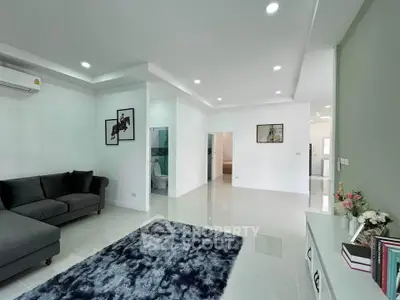 Spacious modern living room with sleek design and elegant decor